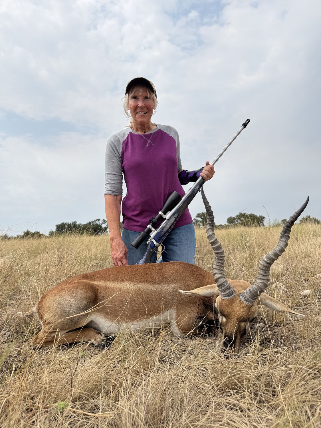 A hunter with a blackbuck antelope on a Hill Country hunt