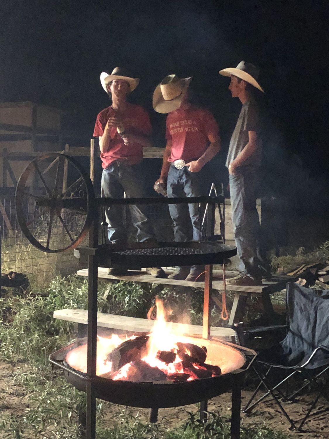 Hunters around the fire pit at camp