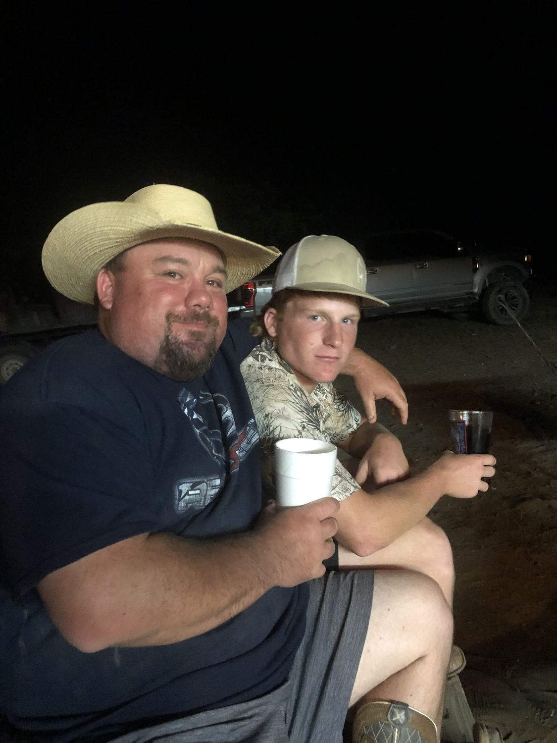Two hunters with coffee at first light