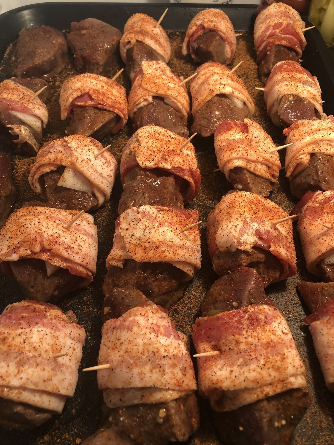Bacon-wrapped jalapeno poppers ready for the fire