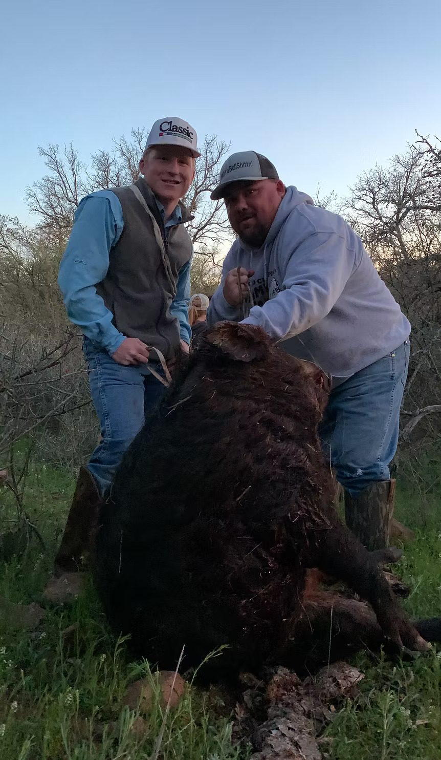 Hunters with a big boar