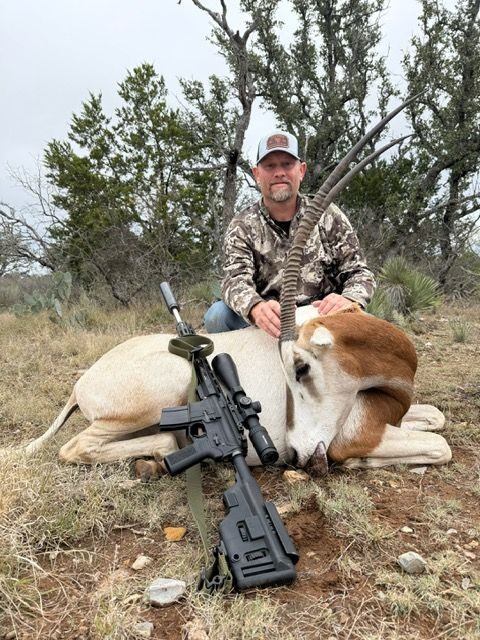 Hunter with a scimitar oryx