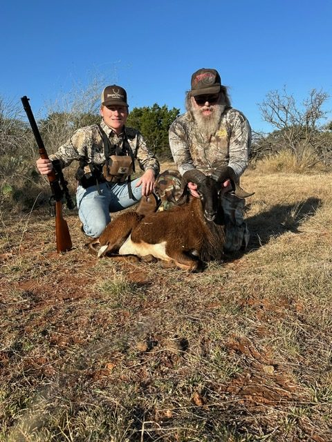 Hunters with a corsican ram