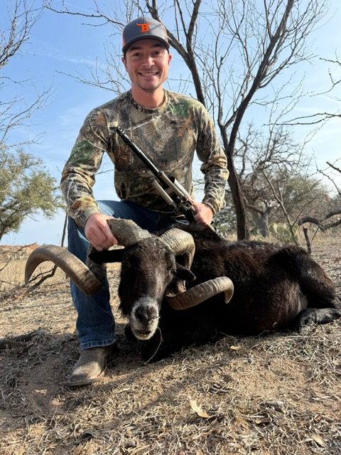 Hunter with a black ram